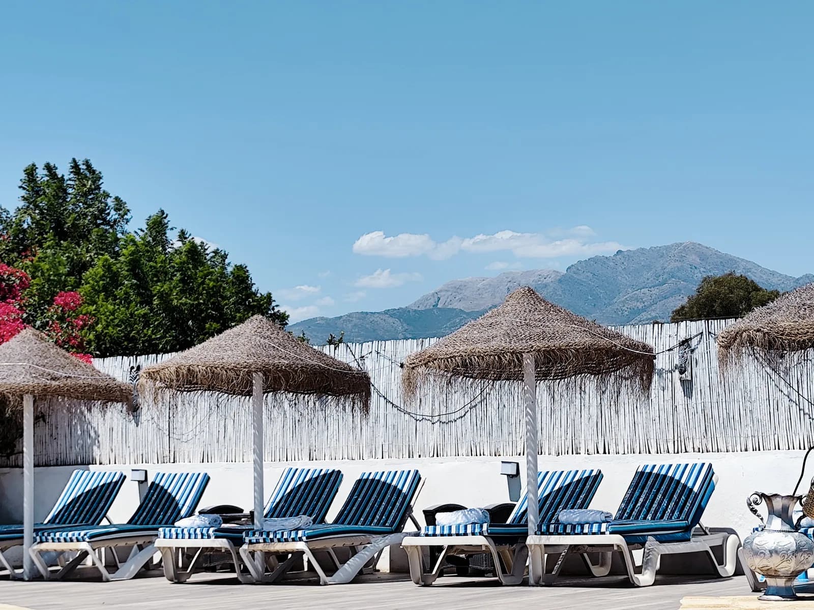 Poolside loungers looking towards the Andalusian mountains